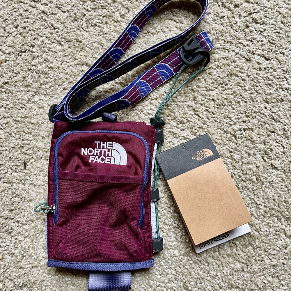The North Face Water Bottle And Phone Holder. Brand New with tags
